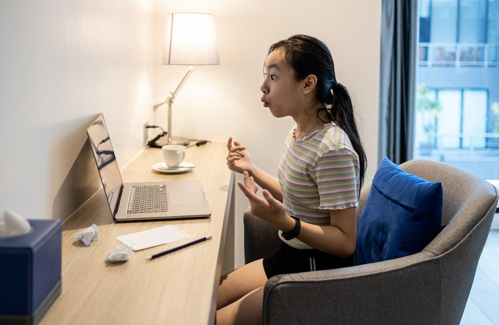 woman-using-mobile-phone-while-sitting-table_1048944-19401207